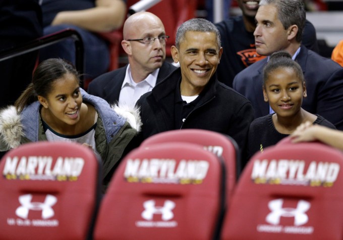 The Obamas At An NCAA college basketball game