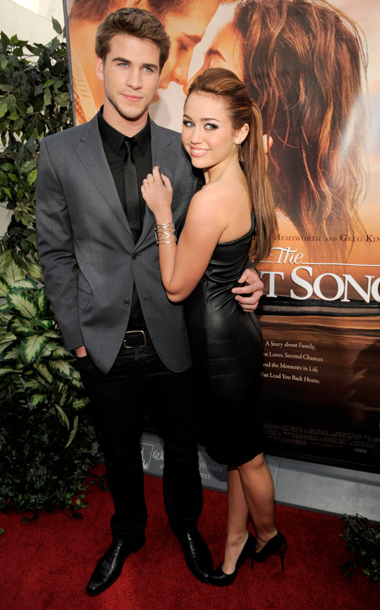 Miley Cyrus, right, and Liam Hemsworth, co-stars of “The Last Song,” pose together at the premiere of the film in Los Angeles, Thursday, March 25, 2010