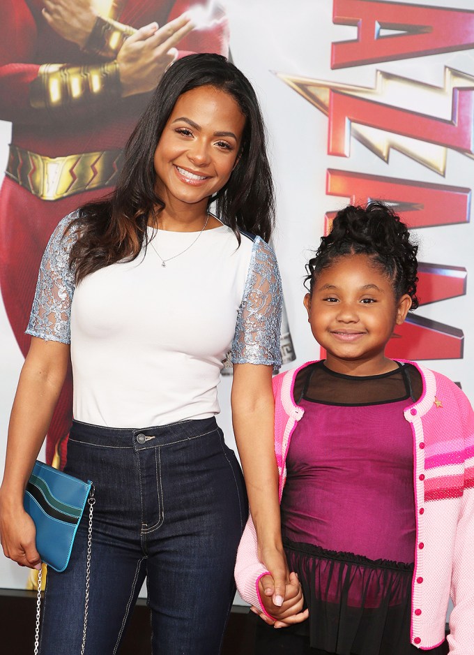 Christina Milian and Violet Madison Nash pose and hold hands