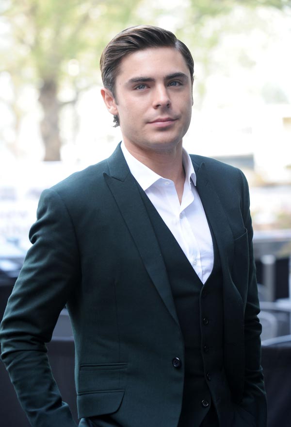Zac Efron shows off a combed over hair style