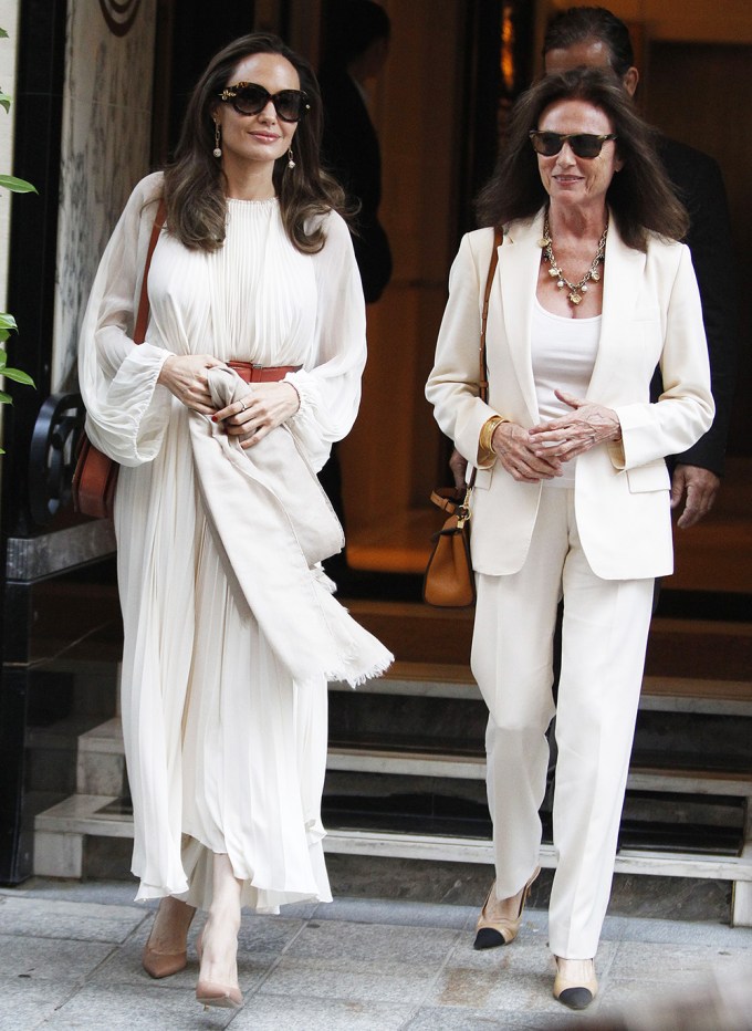 Angelina Jolie & Jacqueline Bisset In Cream Outfits