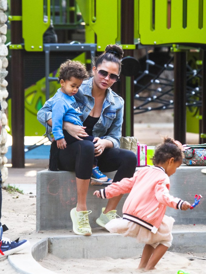 Chrissy Teigen playing with her kids