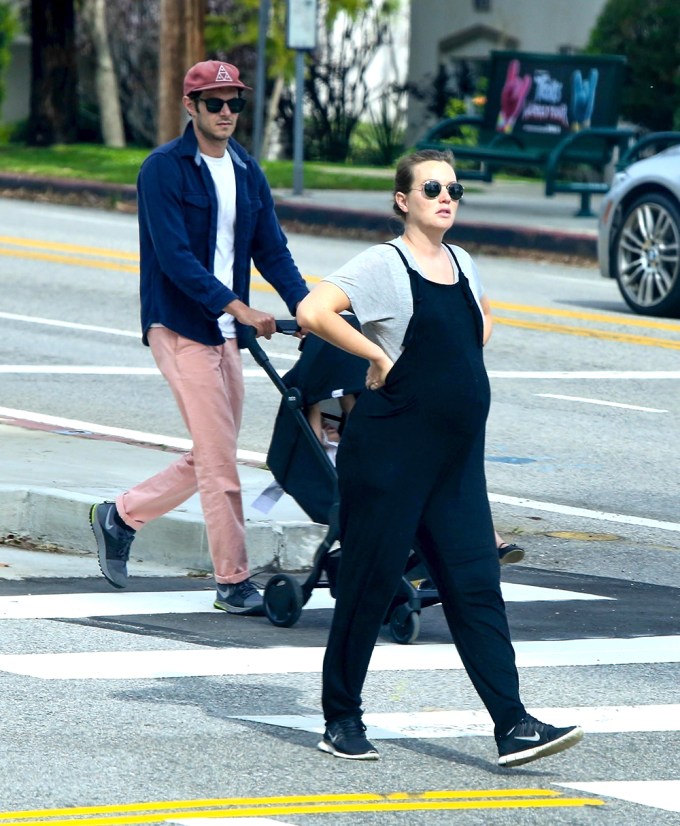 Pregnant Leighton Meester and Adam Brody go for a walk