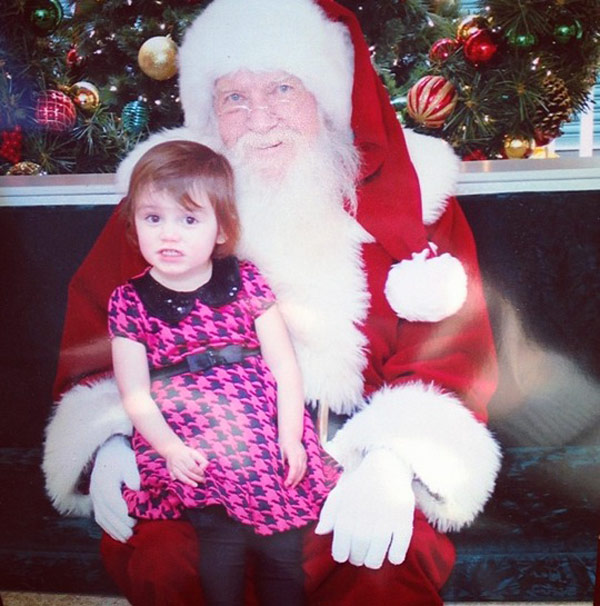 Katie-Yeager’s-daughter-Molli-smiles-with-Santa
