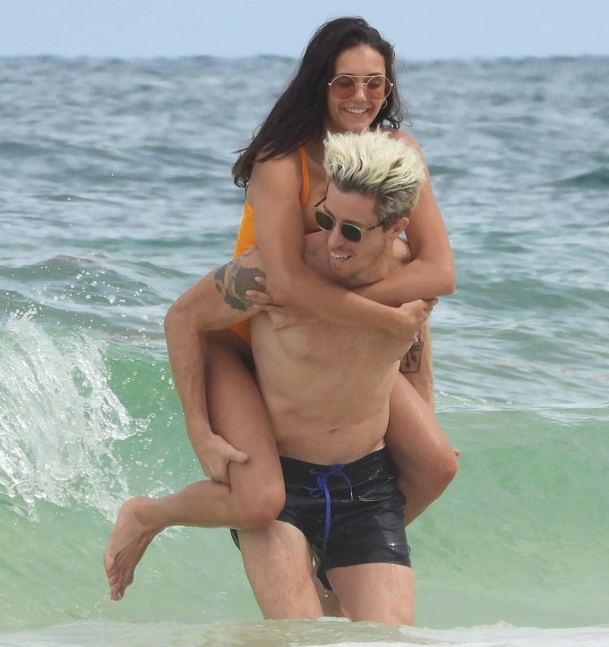 Nina Dobrev and Shaun White having fun in the ocean