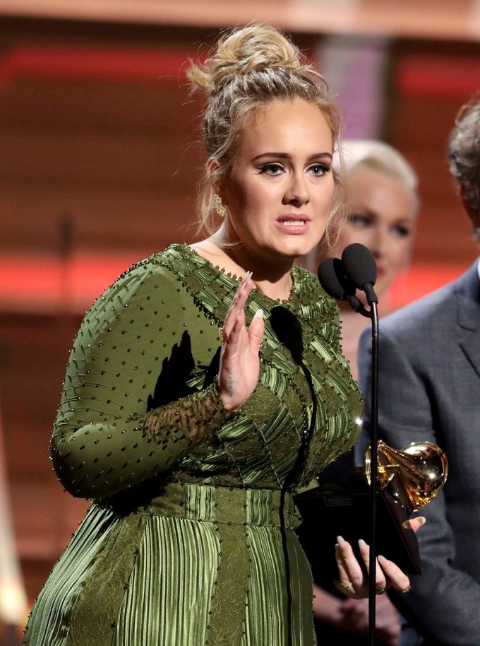 Adele accepts a Grammy Award