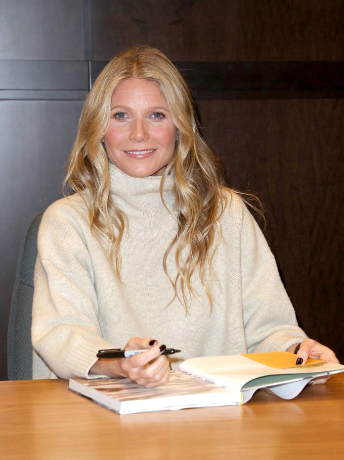 Gwyneth Paltrow posing for photos at her book signing