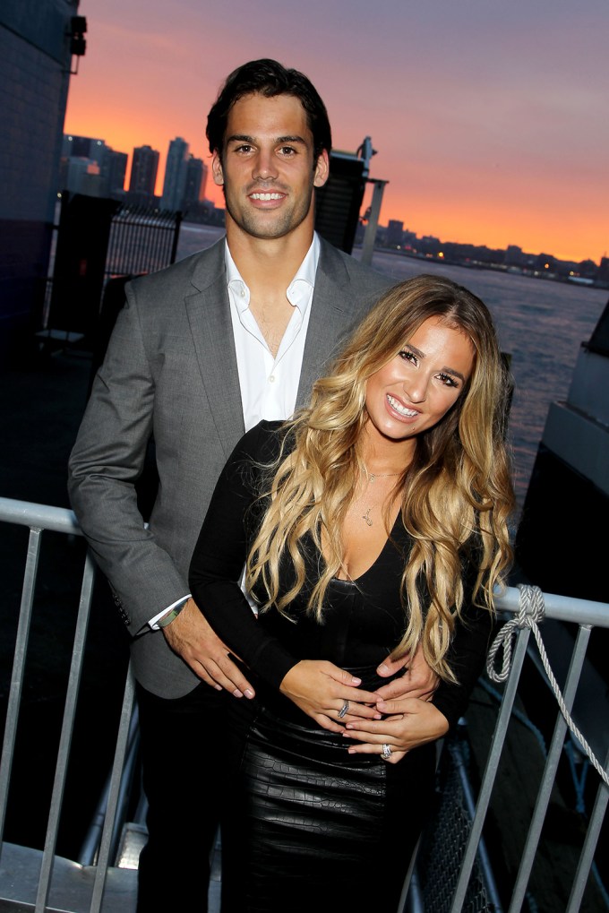 Eric Decker & Jessie James Decker posing in front of a great view
