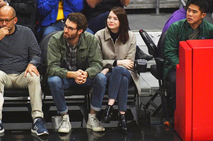 Emma Stone and Dave McCary during a NBA game