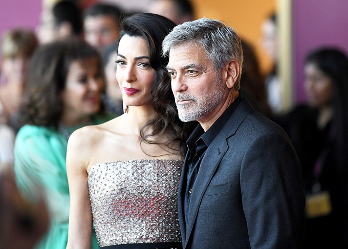 Amal and George Clooney pose at the ‘Catch-22’ TV show premiere