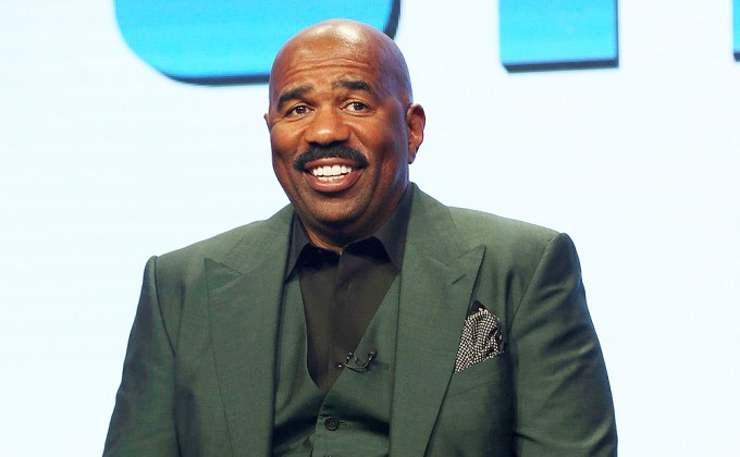 Steve Harvey serving on a panel during a press tour