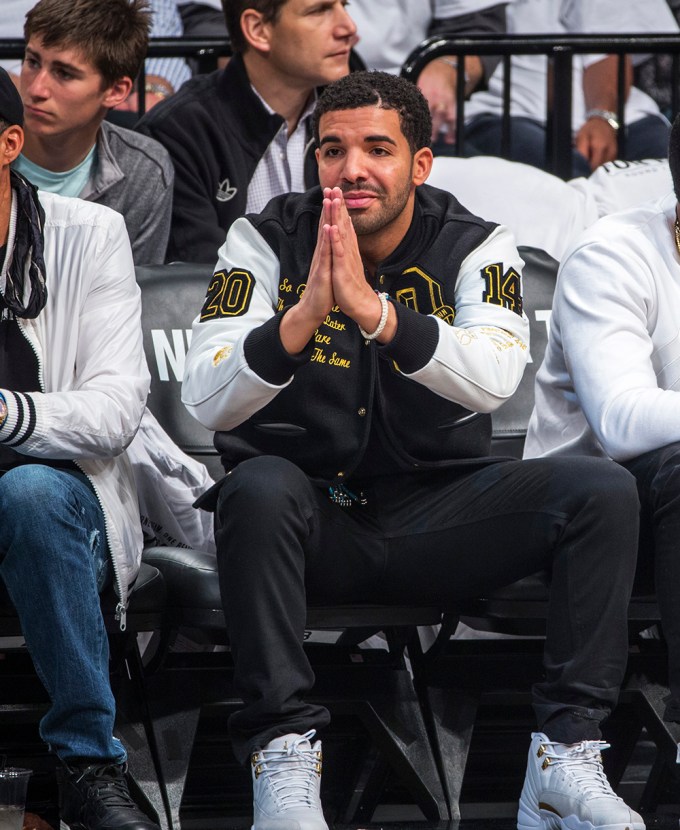 Rapper Drake cheers on the Toronto Raptors as they play the Brooklyn Nets