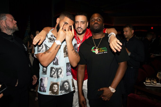 Drake and French Montana having a good time at an event