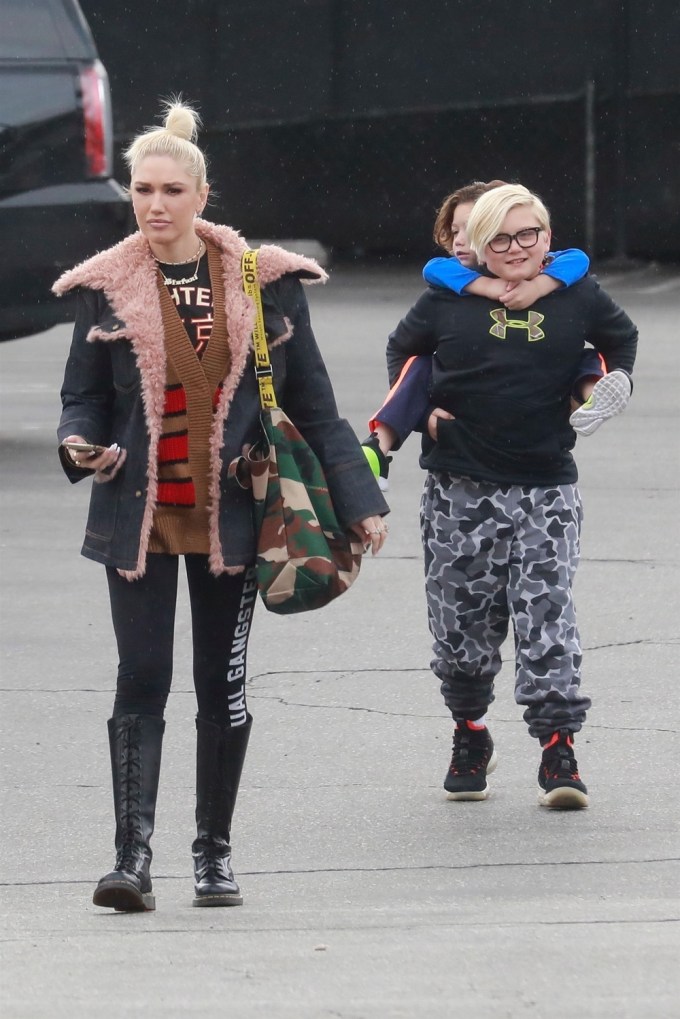 Gwen Stefani walking with two of her sons