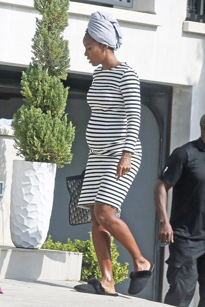Kelly Rowland shows off her burgeoning baby bump