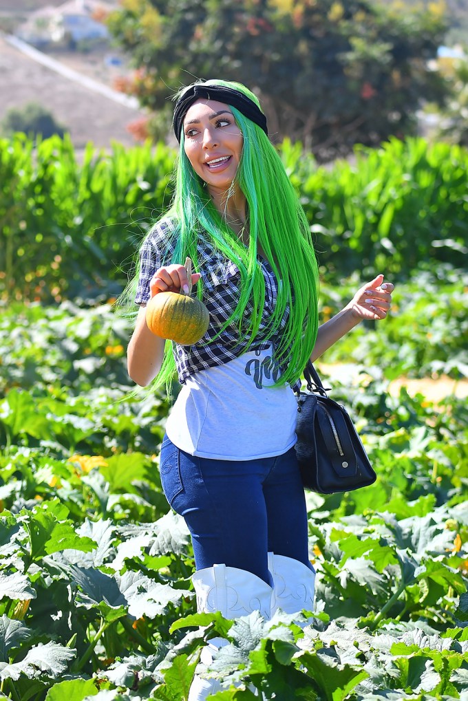 Farrah Abraham dons green hair as she and her daughter Sophia enjoy a day at a pumpkin patch near Los Angeles