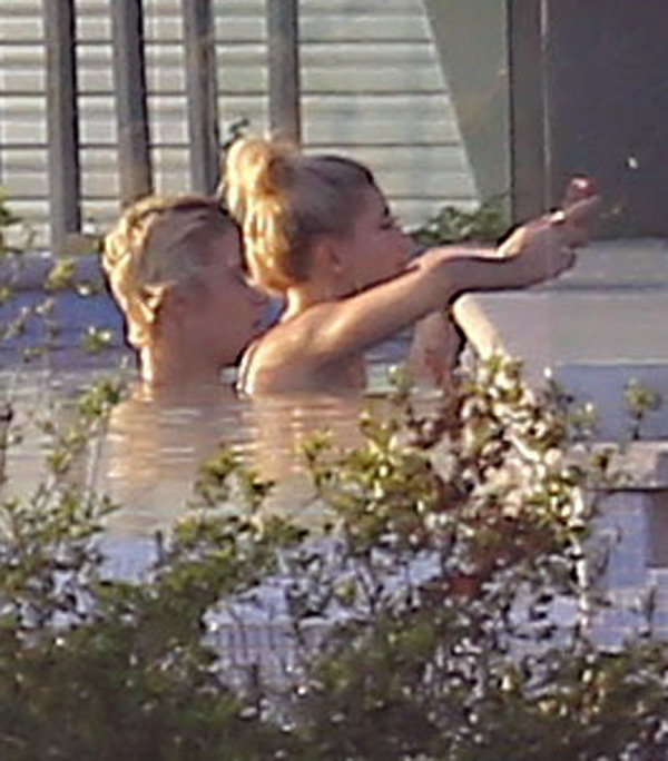 Justin Bieber & Hailey Baldwin get cozy in a pool