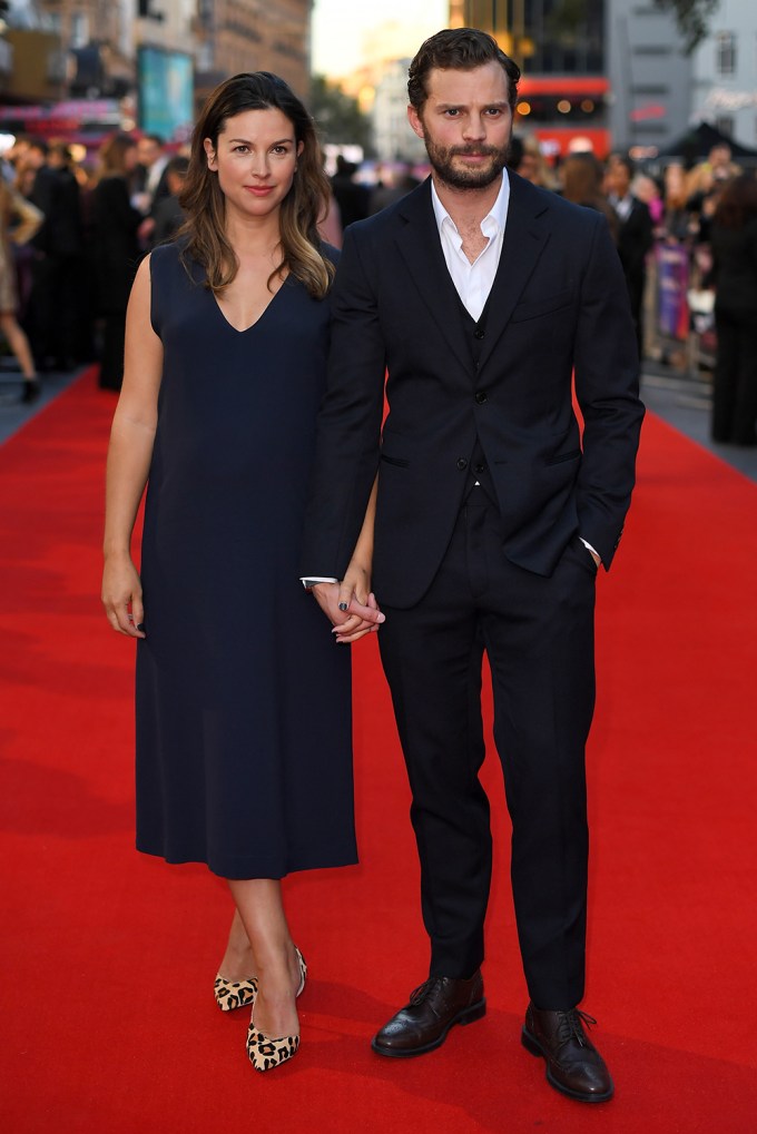 Amelia Warner & Jamie Dornan Holding Hands