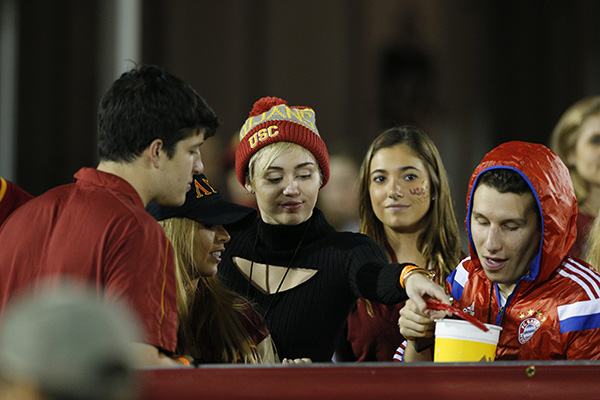 Miley Cyrus and Patrick Schwarzenegger sighting at USC football game
