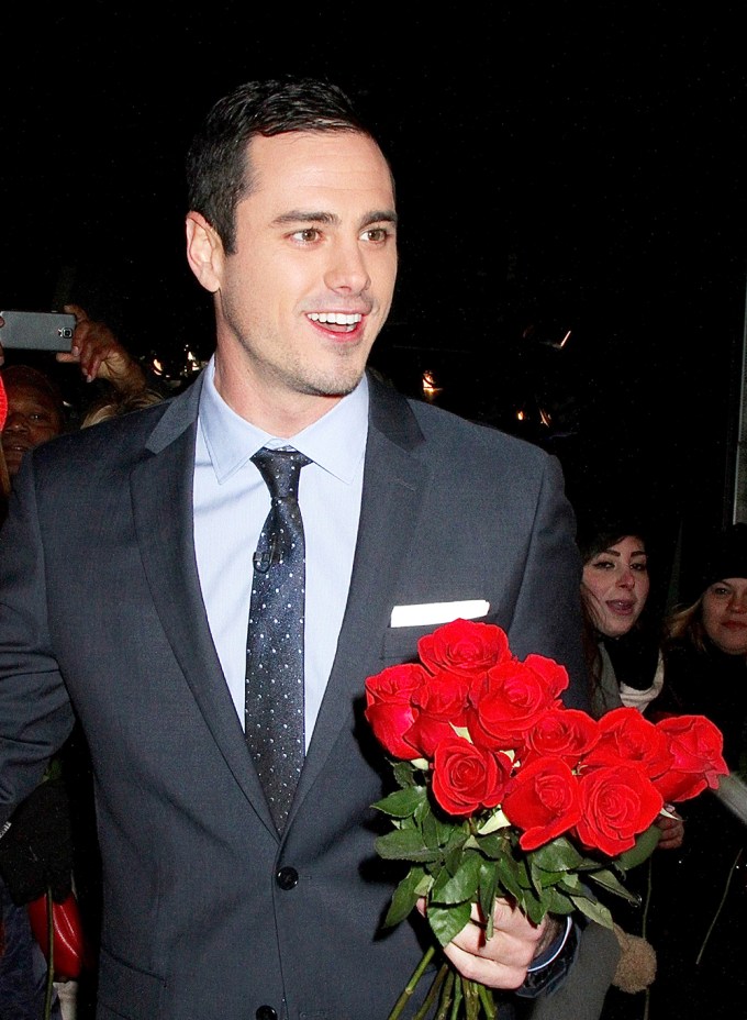 Ben Higgins holding roses
