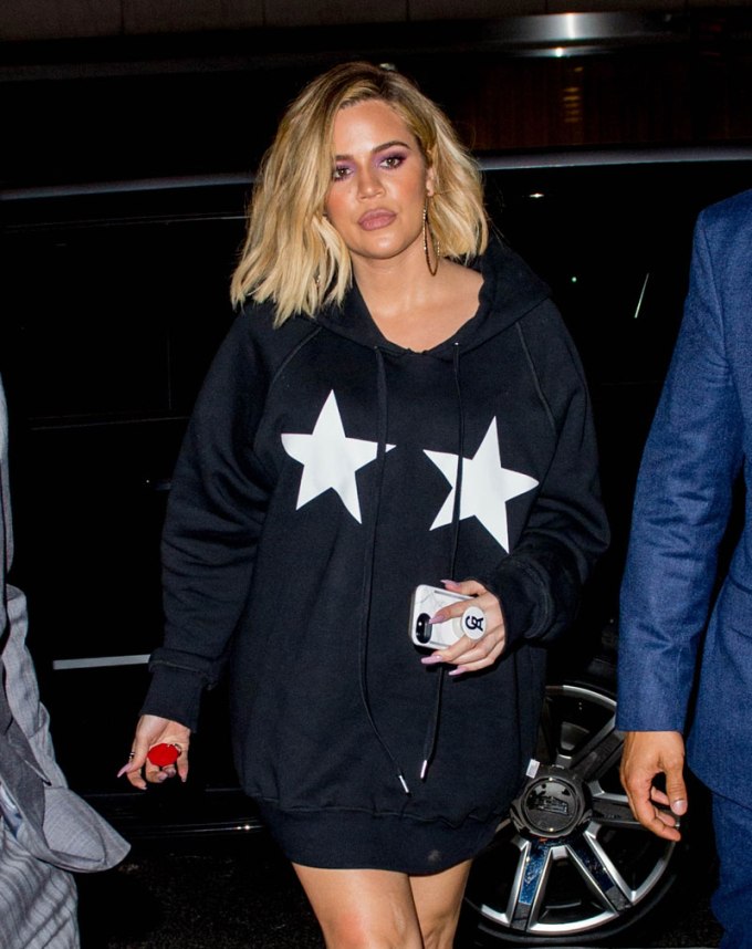 Khloe Kardashian wears a hoodie with stars on it