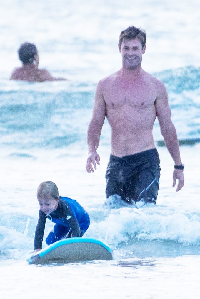 Chris Hemsworth goes shirtless while surfing