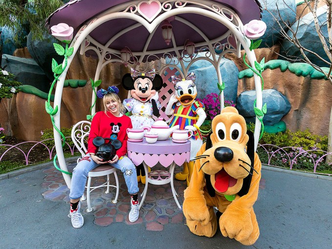 Miley Cyrus At Disneyland With Characters