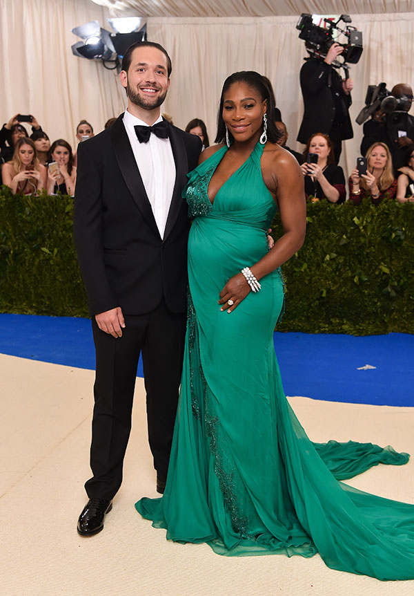 Serena Williams & Alexis Ohanian pose at an event