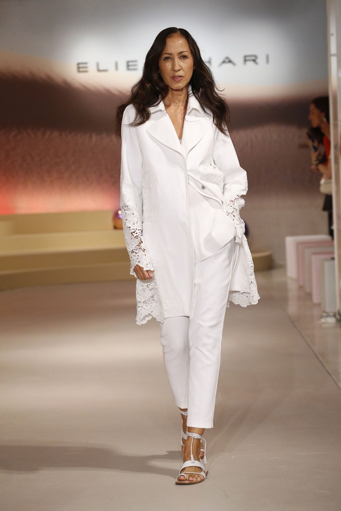 A Model Slays In A White Sophisticated Tahari Look