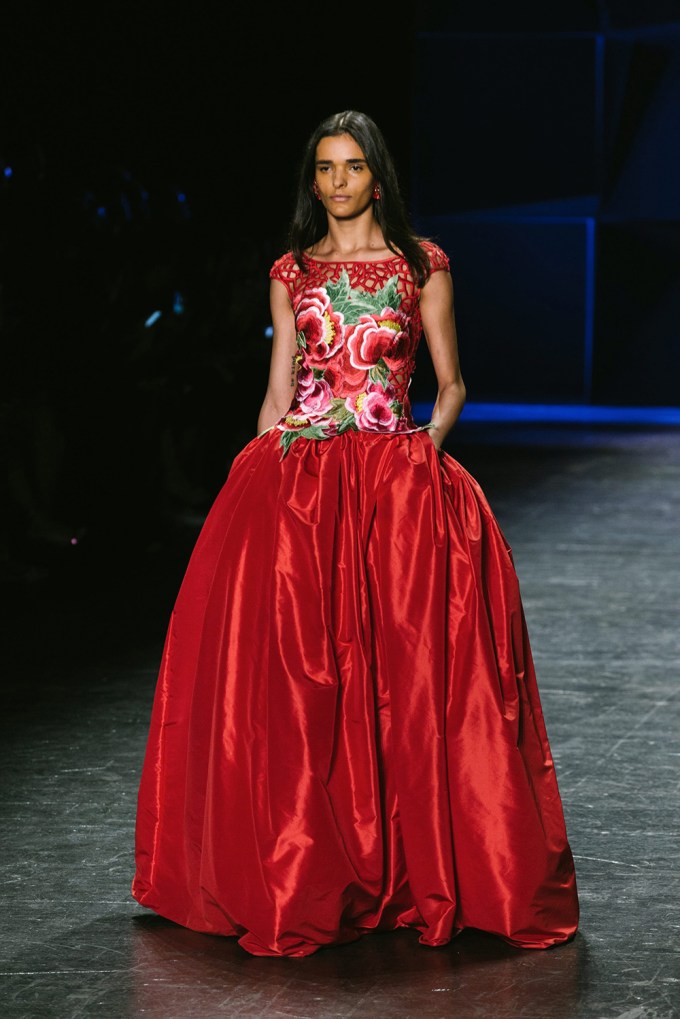 A model in a red dress at the Naeem Khan Show