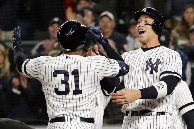 Aaron Hicks celebrates with Aaron Judge during the Astros vs. Yankees Baseball Game