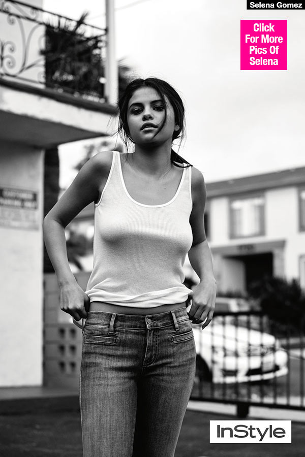 Selena Gomez goes BRALESS in white tank top and jeans as she poses
