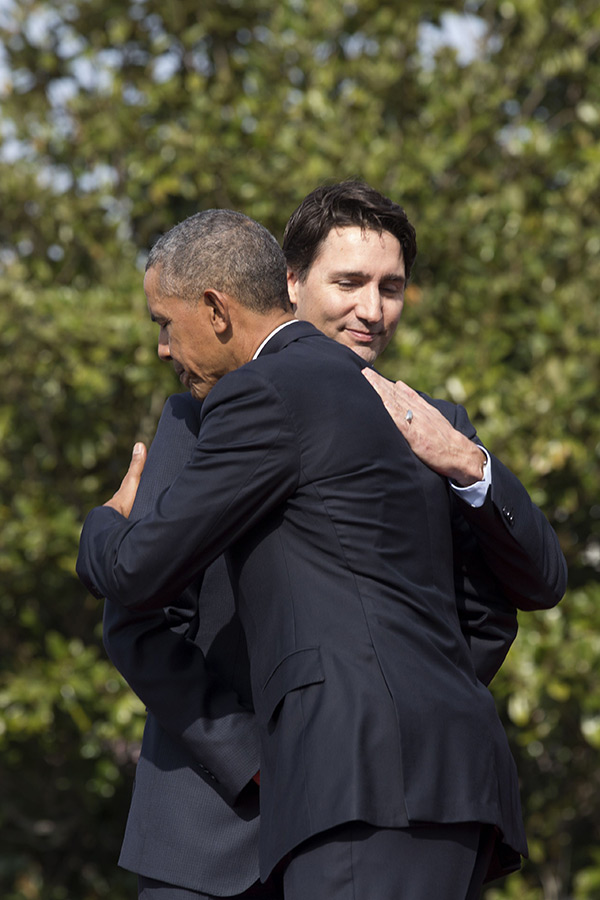 Justin-Trudeau and Barack Obama hug