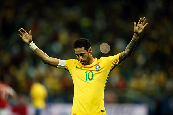 Neymar throws his hands up