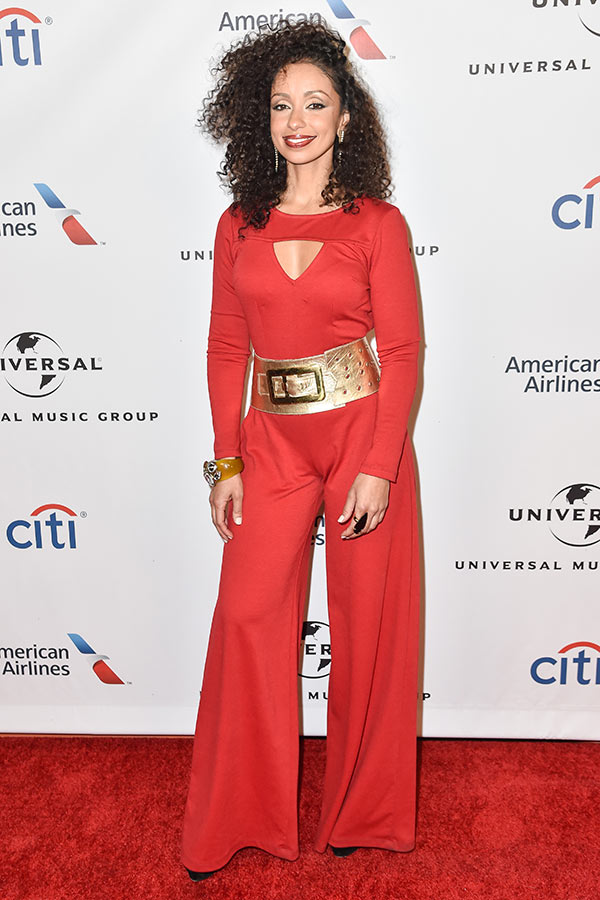 Mya in a red jumpsuit on the red carpet