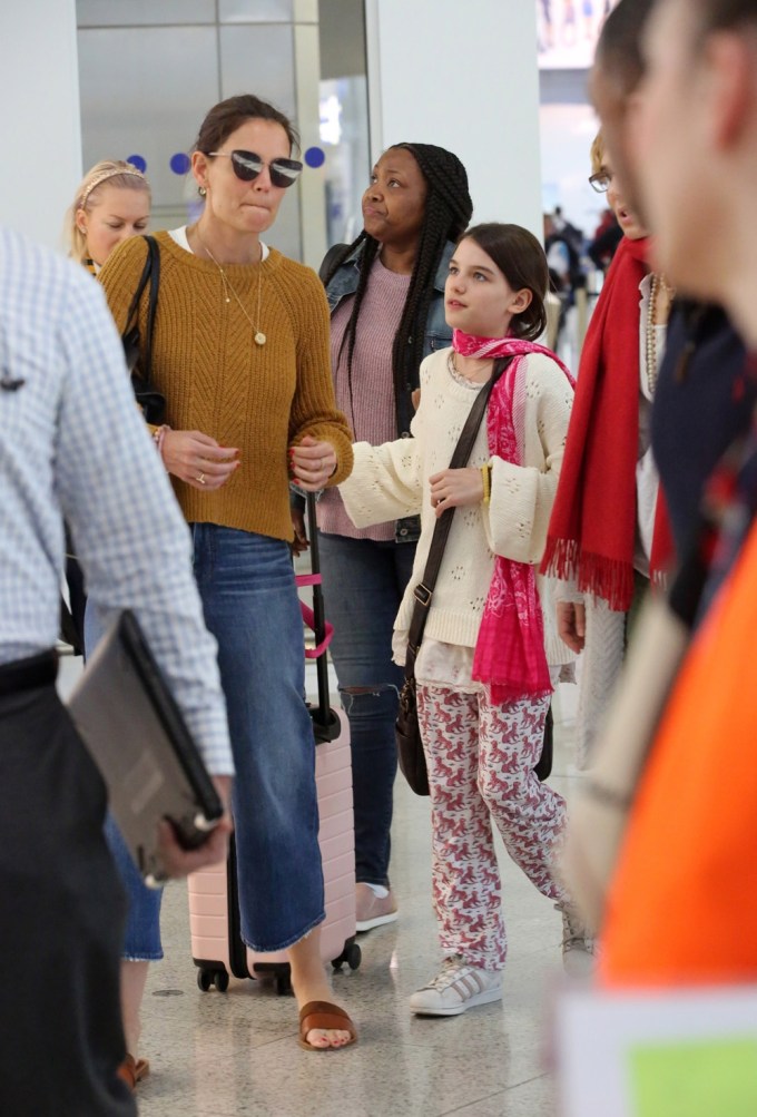 Suri Cruise and Katie Holmes at an airport