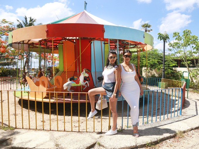 Kim Kardashian and Kourtney Kardashian play together at the playground in Cuba with their kids