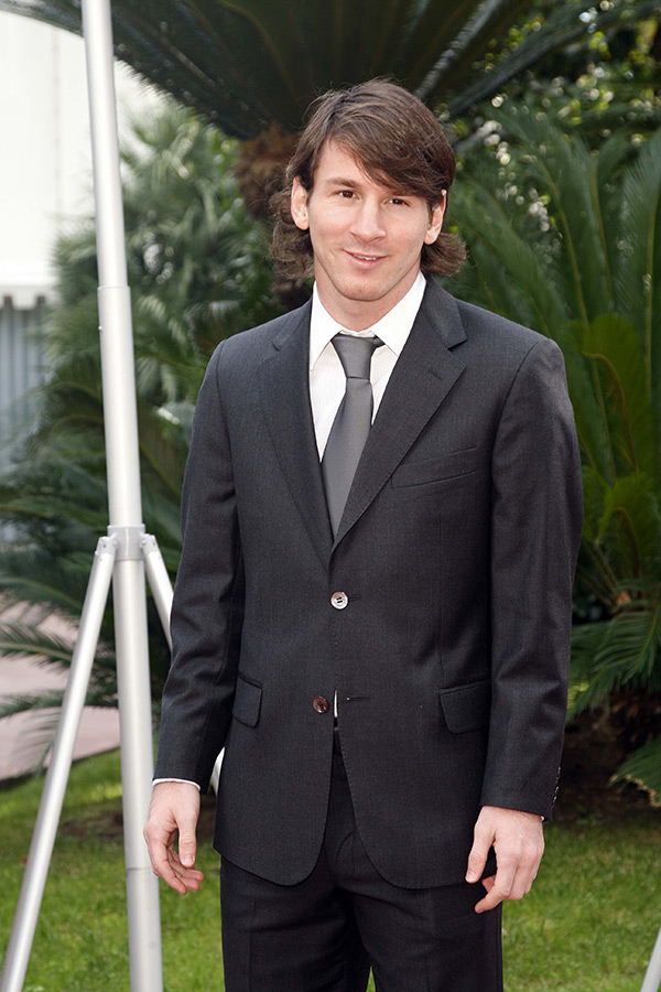 Lionel Messi in a suit and tie