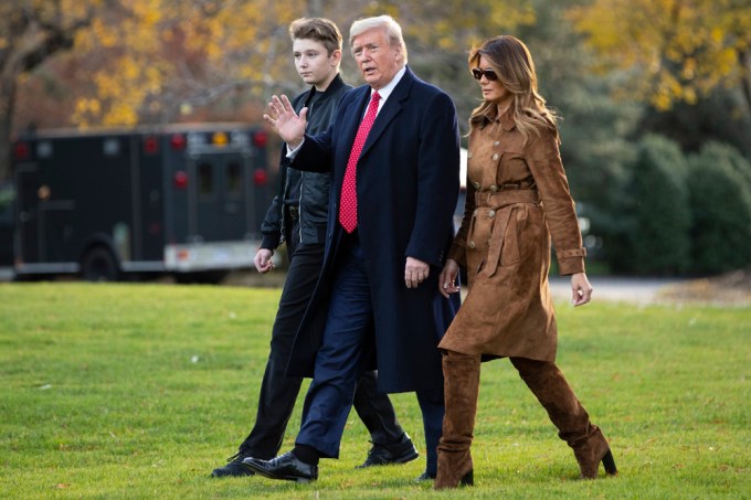 Barron Trump and his parents leave the White house