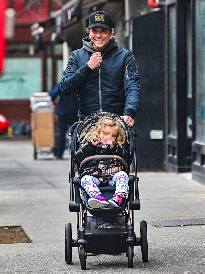 Bradley Cooper Beams Pushing His Daughter