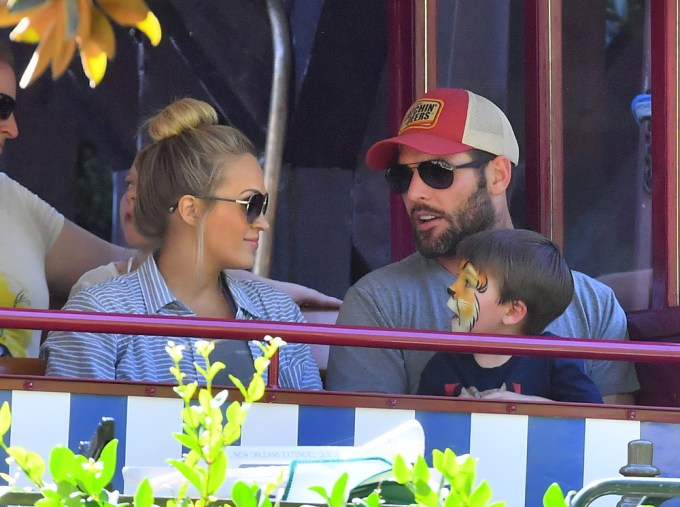 EXCLUSIVE: Carrie Underwood and Mike Fisher take their son on his first trip to Disneyland