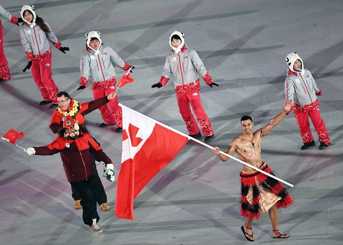 Abs on Display Waving the Flag During Opening Ceremony
