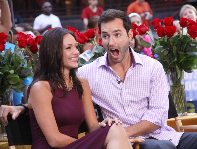 Desiree Hartsock and Chris Siegfried surround by roses