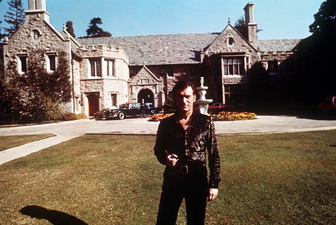 Hugh Hefner Poses Outside Of Playboy Mansion