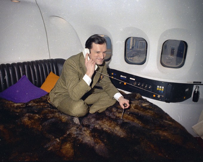 Hugh Hefner Takes A Call In His Private Plane
