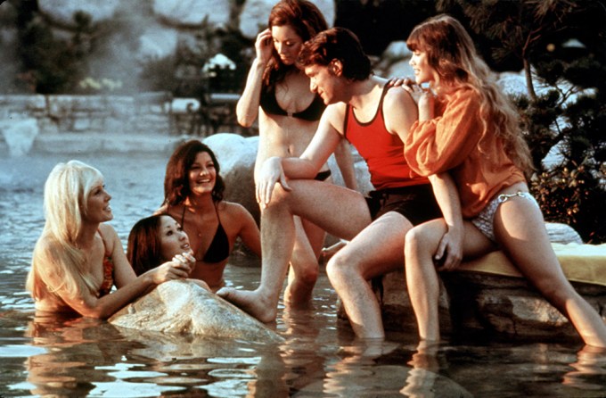 Hugh Hefner Swims With Playboy Bunnies