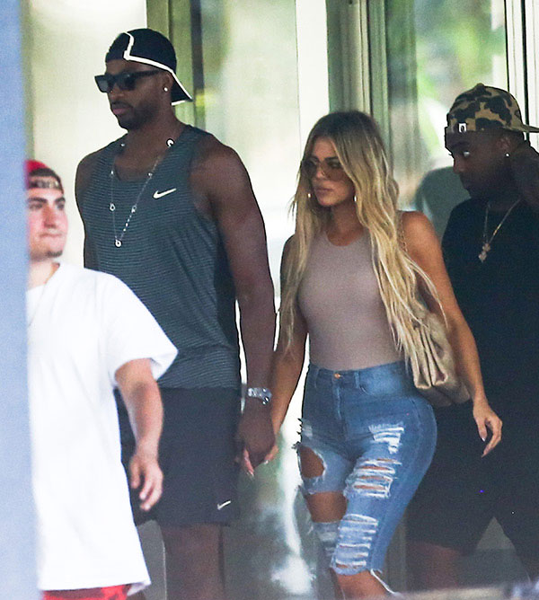 Khloe Kardashian & Tristan Thompson hold hands during an outing