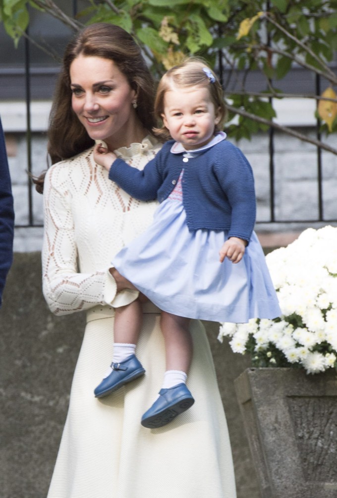 Kate Middleton Carries a Grumpy Princess Charlotte