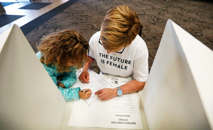 Kirsten Bosch And Her Daughter Voting In Iowa