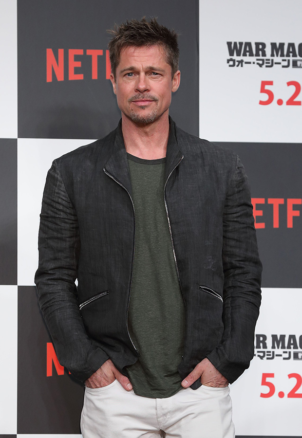 Brad Pitt poses at an event